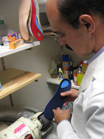 Dr. Prant adjusts an Orthotic